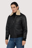 Giubbotto imbottito in pelle con colletto in shearling 1