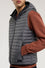 Reversible padded gilet with hood