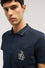 Polo regular fit con tasca in piquet