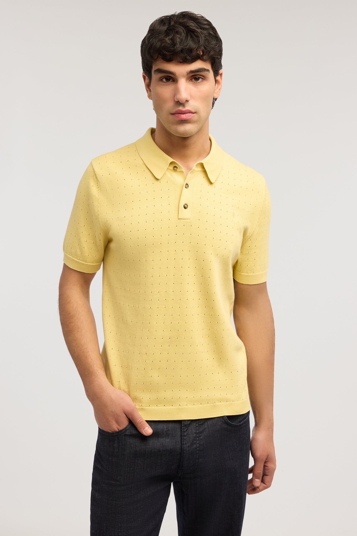 Polo effetto punzonato in cotone 1|9ac698235e453956bd043d992a19e703dfbca51e4fc850cca91d593dc5a0dd98