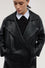 Double-breasted leather trench coat